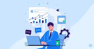 A man in a blue suit sits at a desk with a laptop, surrounded by icons including a graph, email, and chat bubbles, against a light blue background.